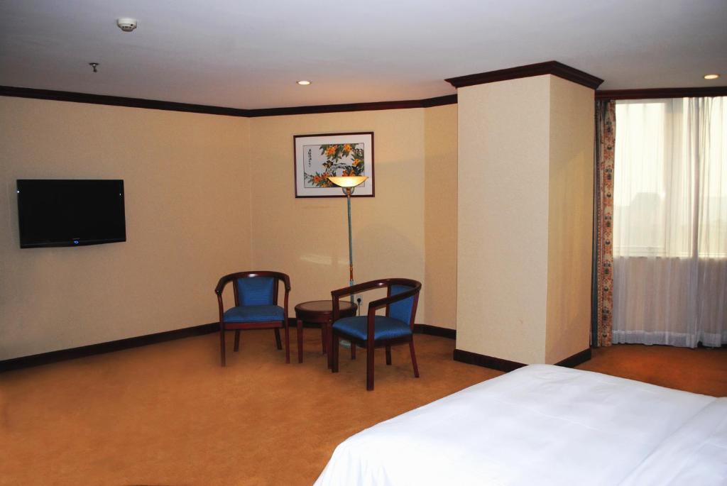 Guangzhou New Century Hotel Room photo